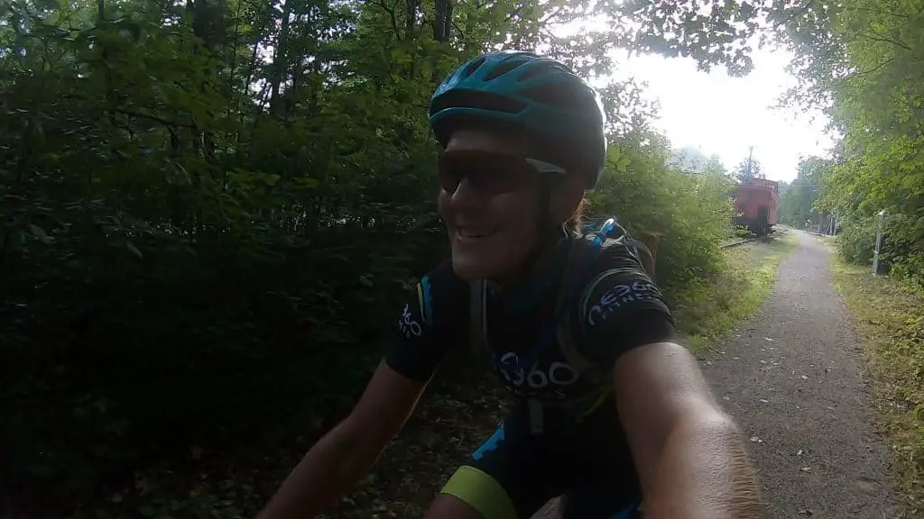 Karen riding bike on rail trail